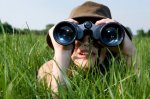 self discovery little girl with binoculars