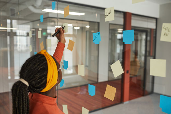 woman writing on a board